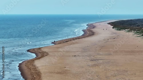 drone footage of a sandy beach shoreline in County Wexford, Ireland