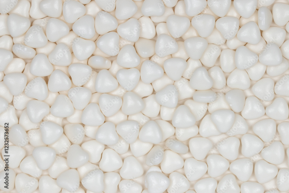 White Heart-Shaped Polystyrene Foam Packing Material Background: Close-up View of Protective Packaging Material Pattern for Shipping and Storage White Heart-Shaped Polystyrene Foam Packing Material Background: Close-up View of Protective Packaging Material Pattern for Shipping and Storage