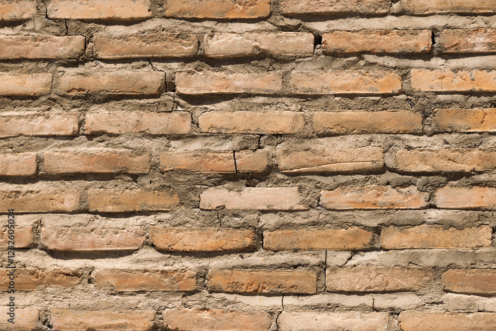 A textured background of a red brick wall with ceramic tiles featuring intricate patterns A textured background of a red brick wall with ceramic tiles featuring intricate patterns