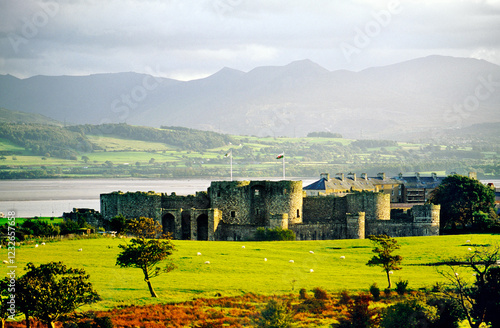 Obraz na płótnie Beaumaris Castle visitor attraction, Anglesey, north Wales, UK with Menai Strait and mountains of Snowdonia behind w salonie