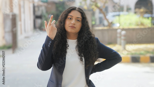 Disappointed Indian Businesswoman Looking in the Camera photo