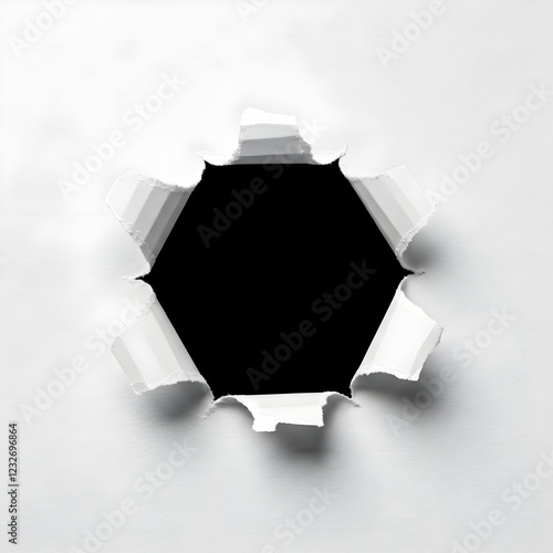 A clean, crisp hole punched through a sheet of white paper. The hole is roughly pentagonal and completely black. Ripped edges of the paper are irregular and uneven, with some overlapping sections.  