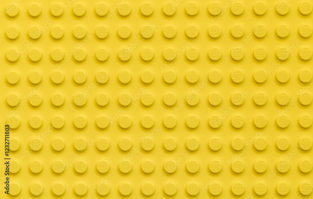 Naklejka premium Yellow background of the LEGO Classic plate