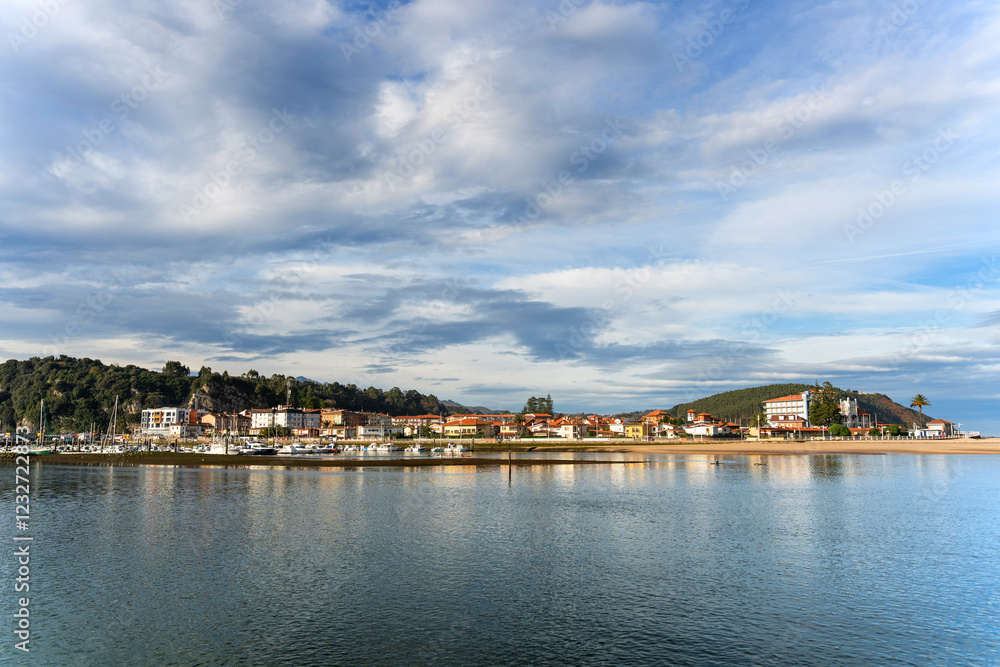 Ribadesella reflecting on the calm waters of sella river in asturias, spain Ribadesella reflecting on the calm waters of sella river in asturias, spain