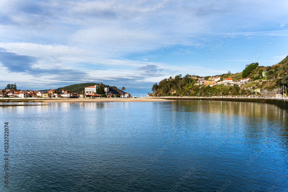 Ribadesella reflecting on the calm water of the sella river in asturias Ribadesella reflecting on the calm water of the sella river in asturias