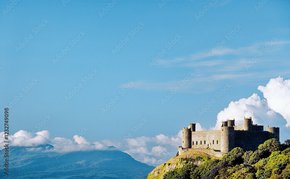 Harlech Castle in Gwynedd on the west coast of Wales, UK. Built by King Edward 1st. Snowdonia mountains in distance