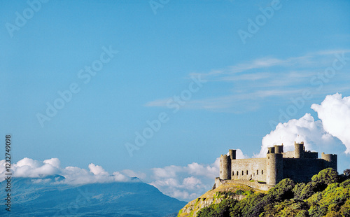 Obraz na płótnie Harlech Castle in Gwynedd on the west coast of Wales, UK. Built by King Edward 1st. Snowdonia mountains in distance w salonie