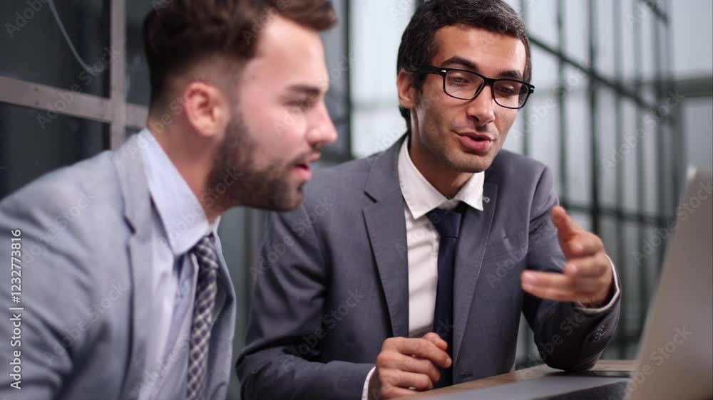 Image of business partners discussing business plan Image of business partners discussing business plan