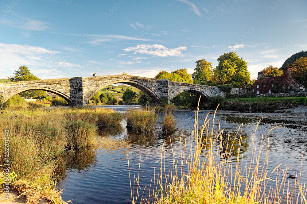 The Pont Fawr road bridge crosses the River Conwy in the old town of Llanrwst in the Conwy Valley, Gwynedd, Wales, UK