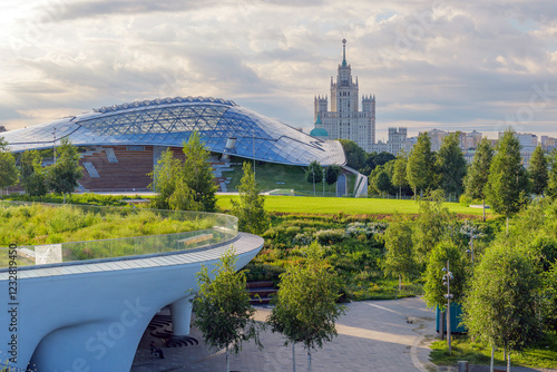 Early morning in Zaryadye Park, Moscow, with summer greenery and a distant view of the Stalinist skyscraper. A calm city atmosphere before the day begins photo