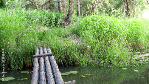 Wooden bridge over a body of water photo