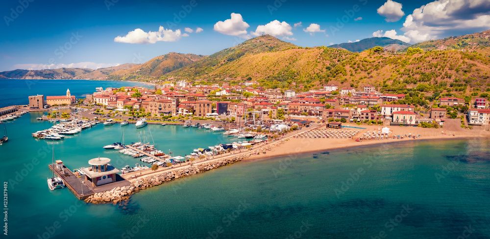 Sunny summer view from flying drone of Acciaroli port. Exciting morning scene of Mediterraneanm coast of Italy. Traveling concept background.