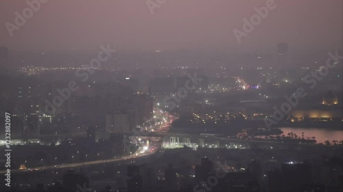 Cairo, Egypt An evening view from the Kornish Al Mokkatam looking south over roads and neighbourhoods in the early evening.  photo