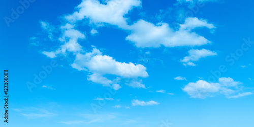 Sunny Blue Sky with Soft White Clouds