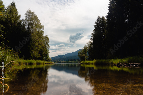 quiet lake with a reflection of a mountain
