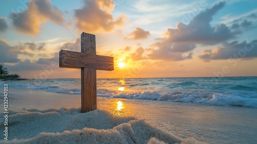 Beautiful sunset over the ocean with a cross on the beach during twilight