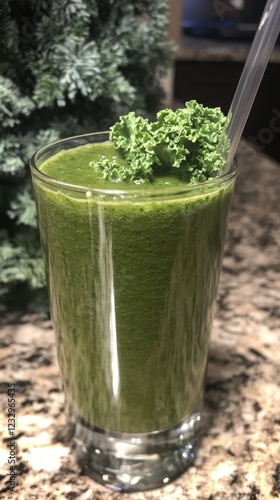Refreshing green smoothie with kale and spinach garnished with fresh leaves