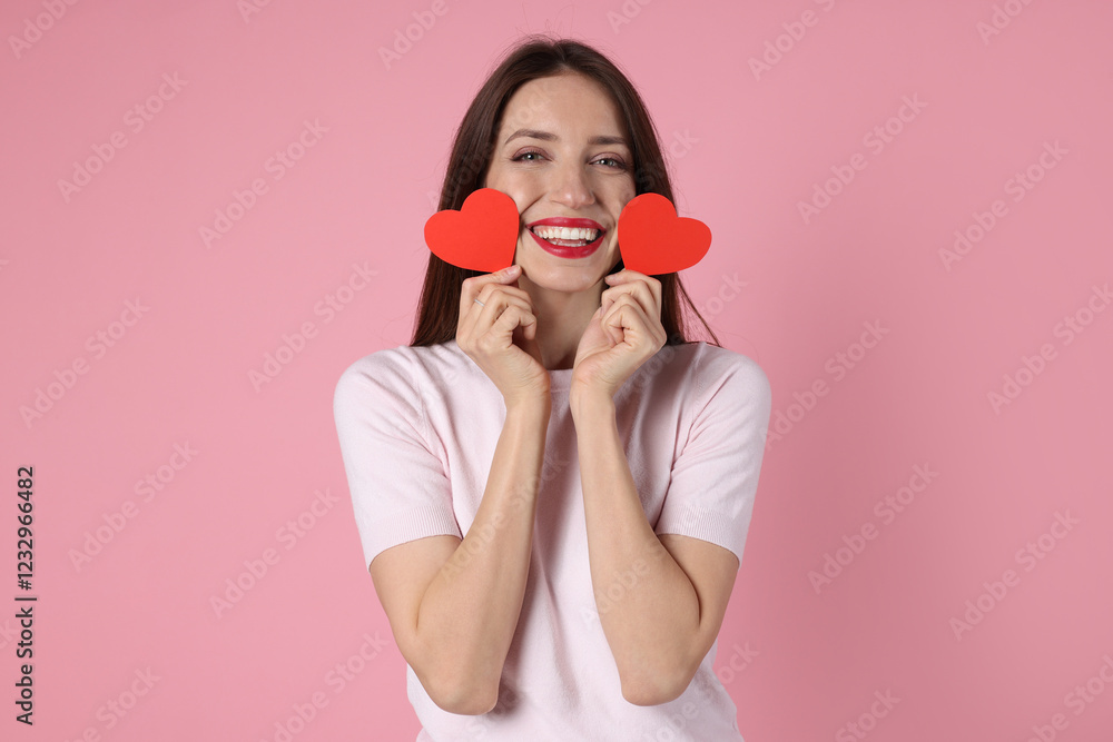 Happy Valentine's Day. Beautiful woman with paper hearts on pink background Happy Valentine's Day. Beautiful woman with paper hearts on pink background
