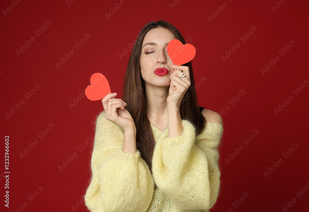 Happy Valentine's Day. Beautiful woman with paper hearts on red background Happy Valentine's Day. Beautiful woman with paper hearts on red background