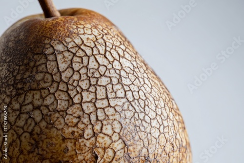 Unique textured surface of a ripe pear showcasing intricate details in natura...