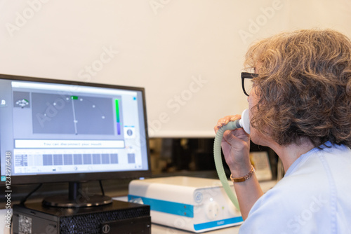 Woman performing a spirometry test in a pneumology lab