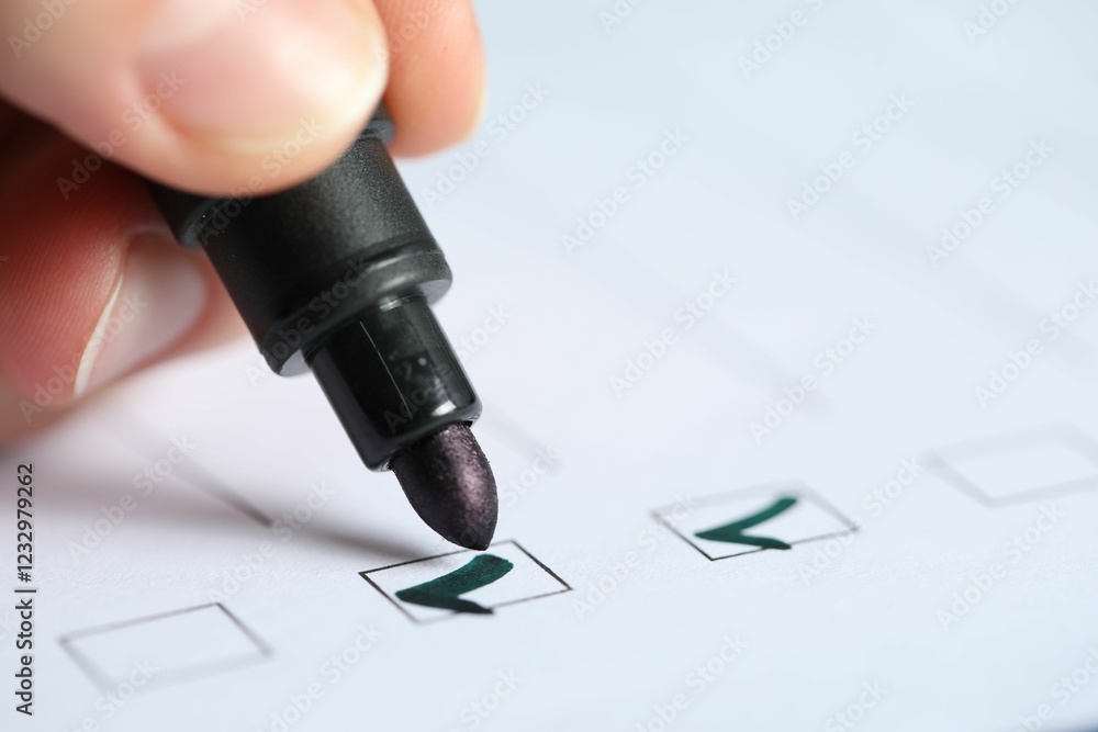 Woman checking box of paper form, closeup Woman checking box of paper form, closeup