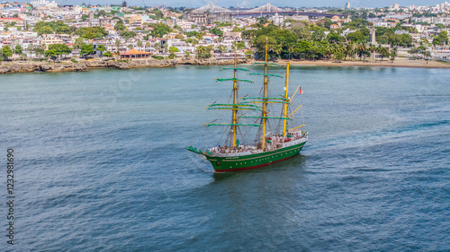 Santo Domingo, Dominican Republic, aerial view of the three masted square rigger Alexander von Humboldt 2, a German sailing ship, is leaving port with city of Santo Domingo in background  