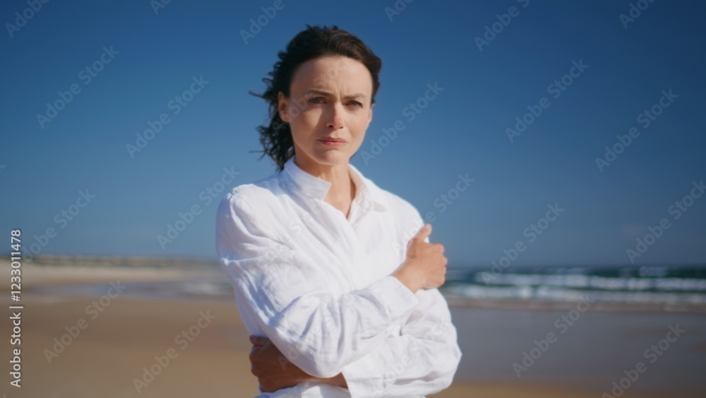 Pensive lady walking sea coast spending weekend on gold sandy beach closeup. Pensive lady walking sea coast spending weekend on gold sandy beach closeup.