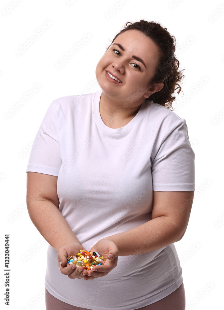 Happy plus size woman holding pile of weight loss supplements on white background Happy plus size woman holding pile of weight loss supplements on white background