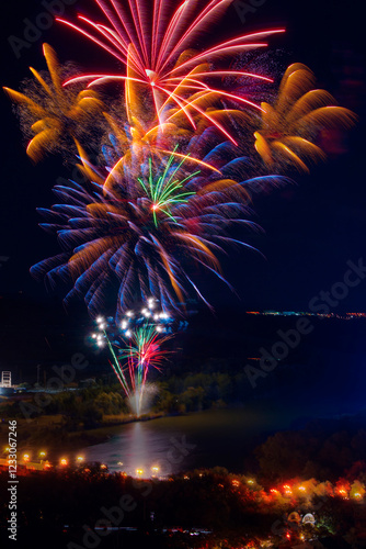 Colorful fireworks display over the Ebro River at night