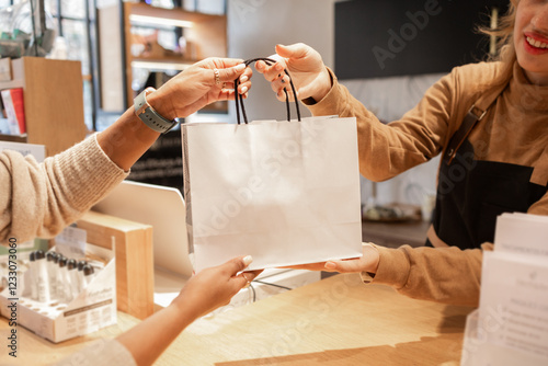 Customer and worker engaging in a cosmetics store transaction