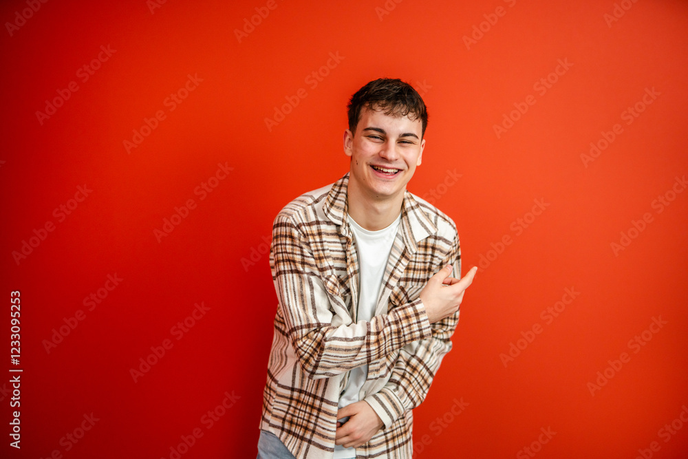 portrait of man stand and show red background behind him studio shot portrait of man stand and show red background behind him studio shot