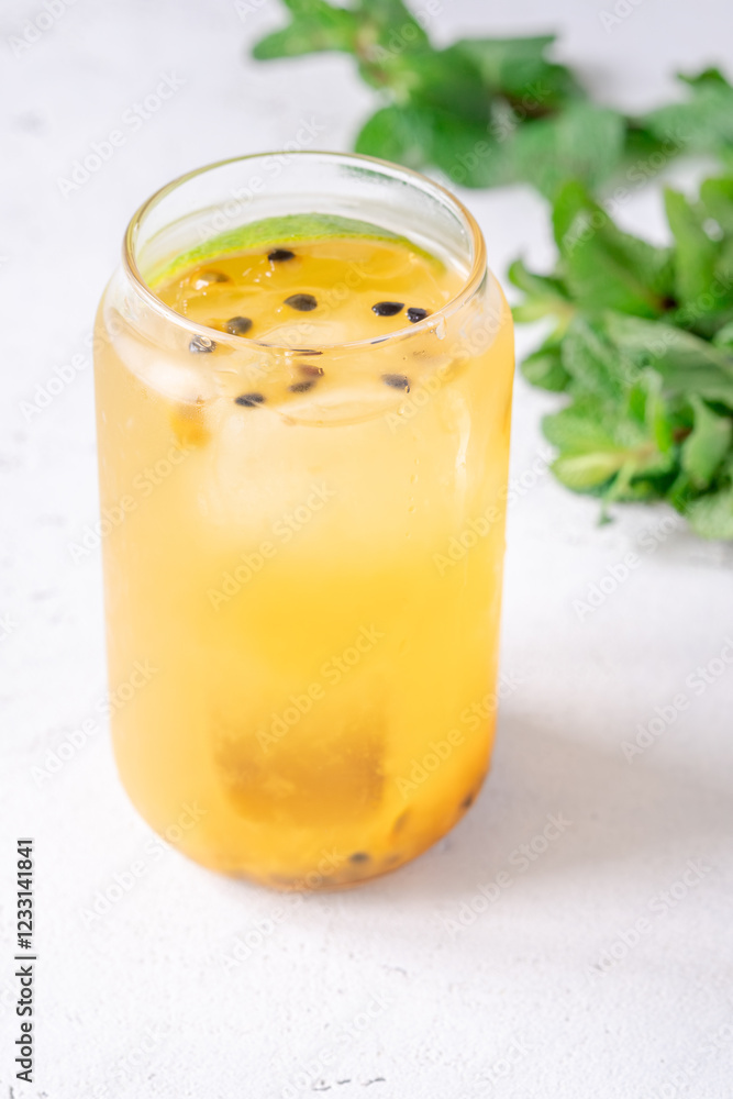 Waltzing Matilda cocktail with passion fruit, gin, and ginger ale in jar glass Waltzing Matilda cocktail with passion fruit, gin, and ginger ale in jar glass