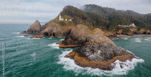 Coastal Oregon landscape with Heceta Head Lighthouse, Dramatic cliffs, waves, and a rugged shoreline. Nature's beauty.  Florence, Oregon, USA photo