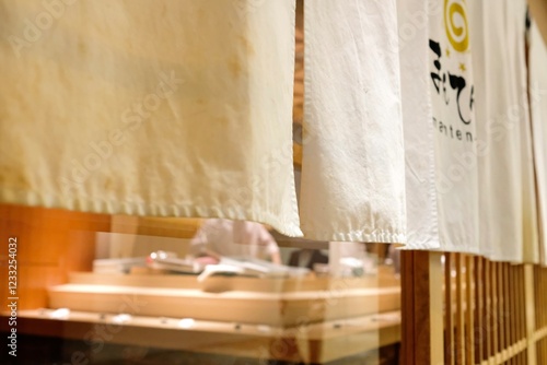 Sushi chefs preparing to serve an omakase lunch at Manten Sushi Marunouchi near Tokyo Station and the Imperial Palace - Chiyoda City, Tokyo, Japan photo