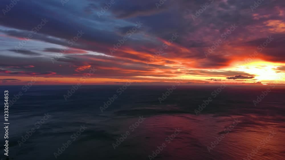 Aerial view of sea surface during a dramatic red sunset, panorama 4k Aerial view of sea surface during a dramatic red sunset, panorama 4k