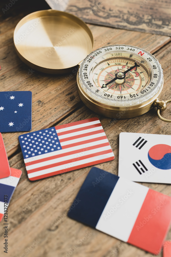 Obraz premium 方位磁石と世界の国旗 旅や旅行のイメージ写真