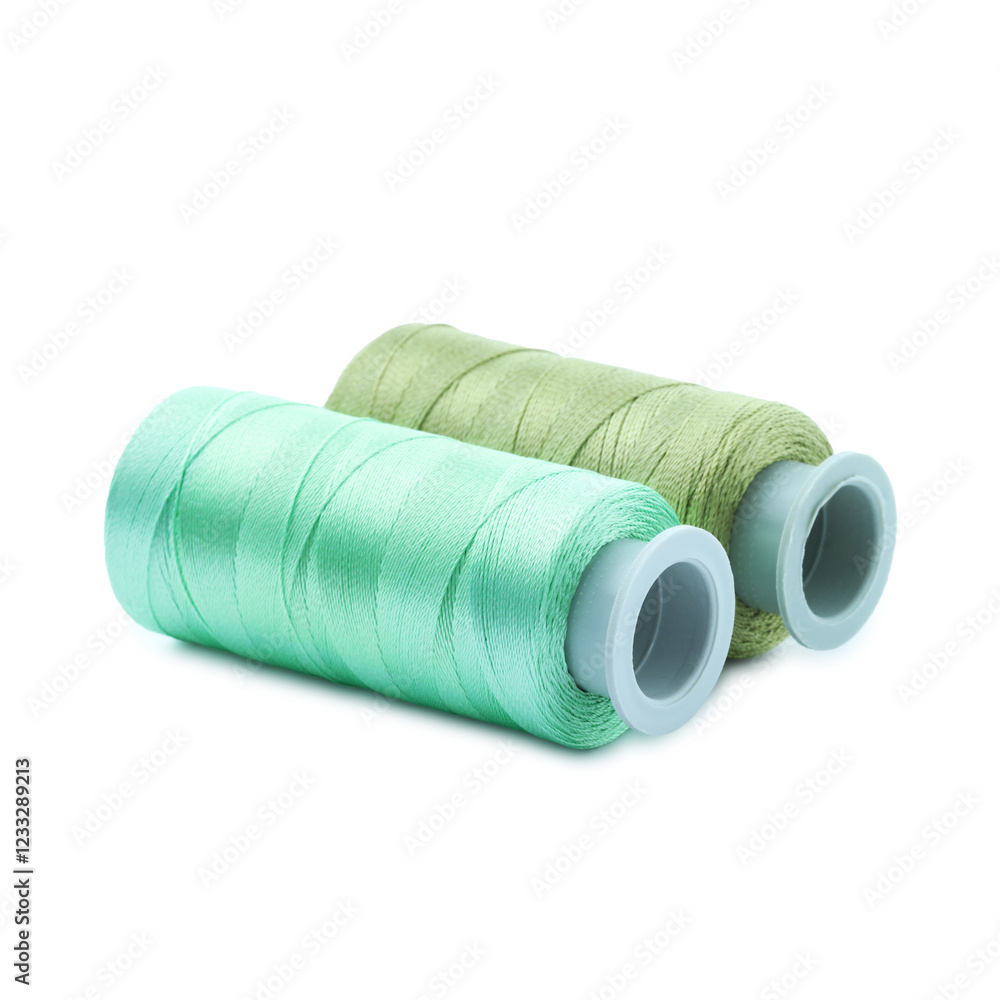 Spools of colorful sewing threads isolated on white Spools of colorful sewing threads isolated on white