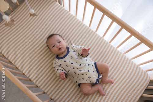 Wallpaper Mural Newborn baby boy relaxing on the cot Torontodigital.ca