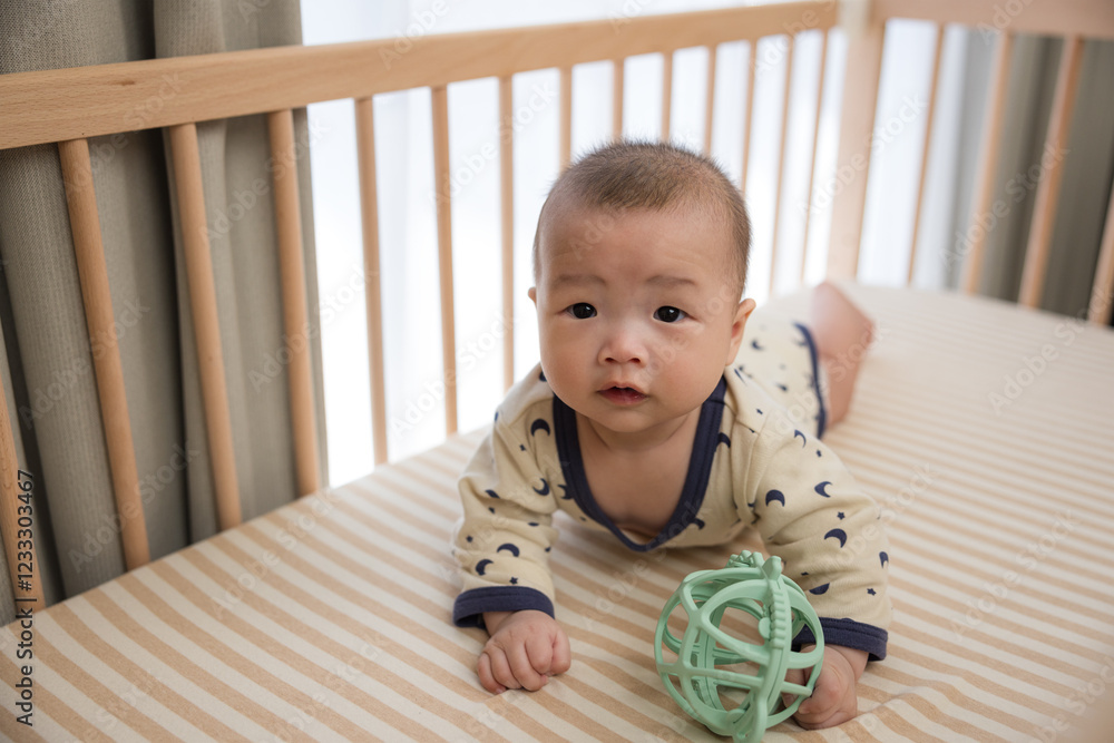 Baby rolling and crawling on bed with play ball Baby rolling and crawling on bed with play ball