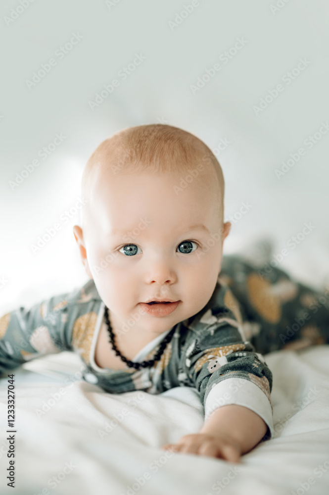 Adorable, relax and portrait of a baby on a bed for sleep, resting and comfort. Looking, content and the face of a child lying in the bedroom for rest, nap or to wake up in the morning at home Adorable, relax and portrait of a baby on a bed for sleep, resting and comfort. Looking, content and the face of a child lying in the bedroom for rest, nap or to wake up in the morning at home