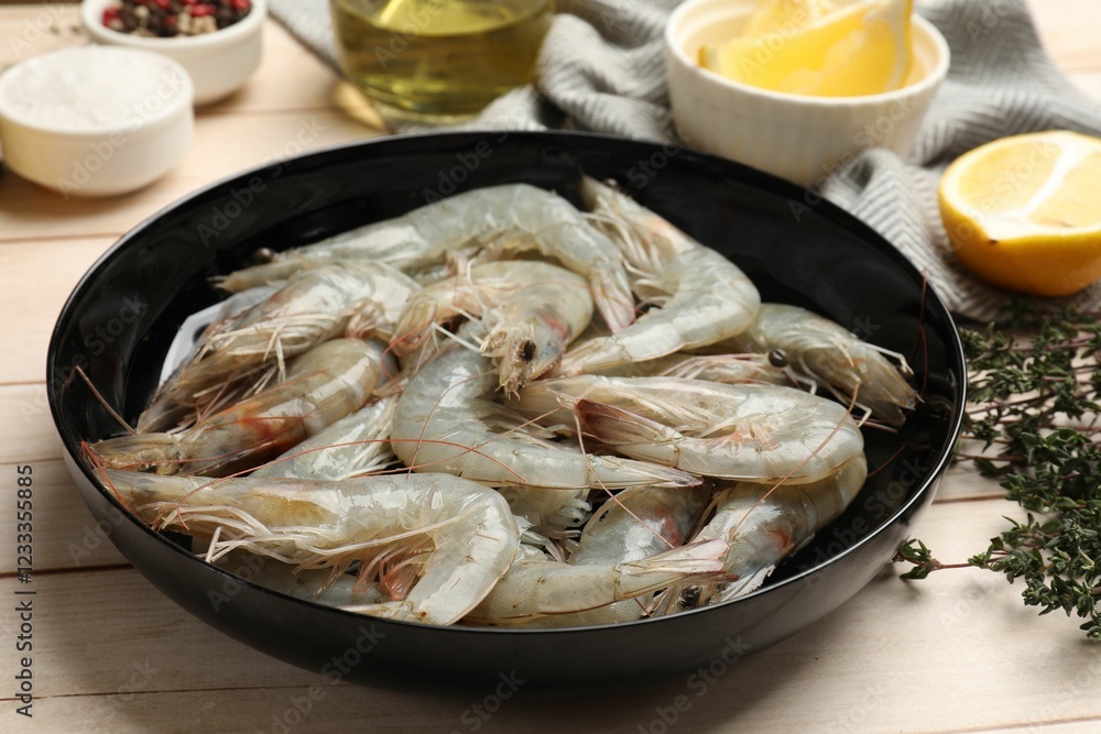 Fresh raw shrimps and spices on wooden table, closeup Fresh raw shrimps and spices on wooden table, closeup