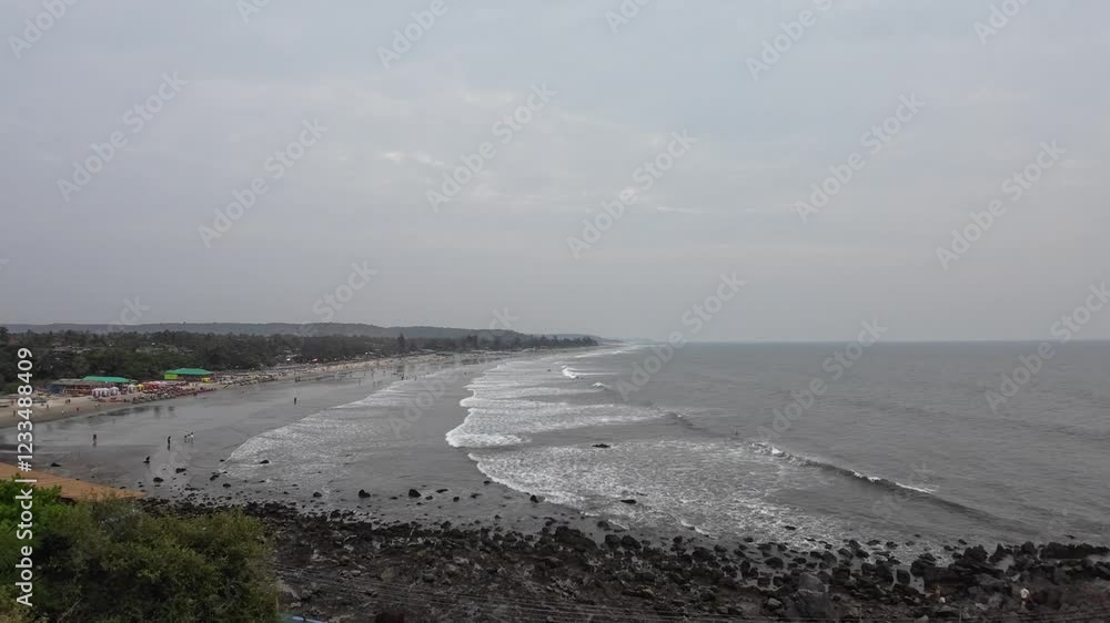 Above View Of Yellow Sandy Beach With Rolling Waves And Sea Shore Above View Of Yellow Sandy Beach With Rolling Waves And Sea Shore