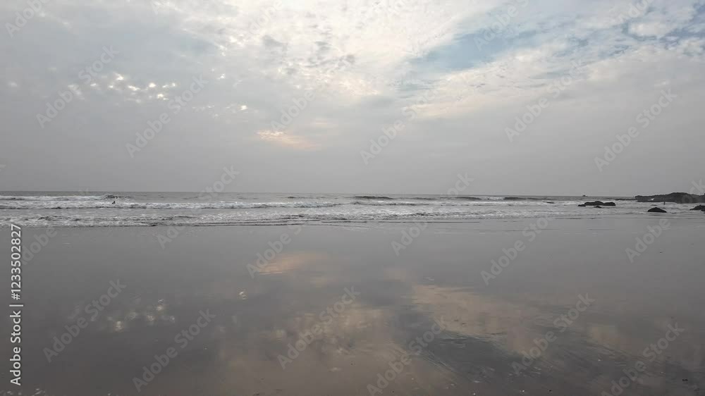 Rolling Ocean Waves At Black Sand Beach Blue Sky Reflect On Beach Sand Rolling Ocean Waves At Black Sand Beach Blue Sky Reflect On Beach Sand