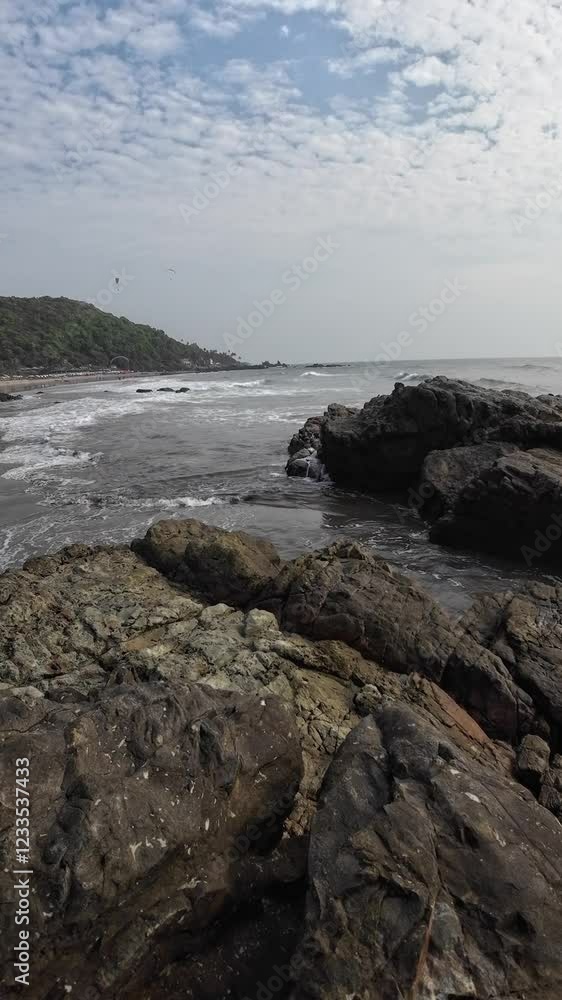 Ocean Waves Crashing On The Big Black Rocks On The Seashore Ocean Waves Crashing On The Big Black Rocks On The Seashore