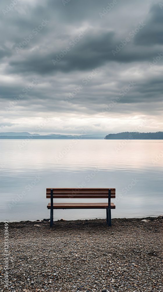 Solitude by the Lake: A Serene Bench Under a Cloudy Sky Solitude by the Lake: A Serene Bench Under a Cloudy Sky