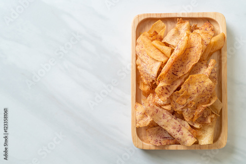 Taro Chips - fried or baked sliced taro photo