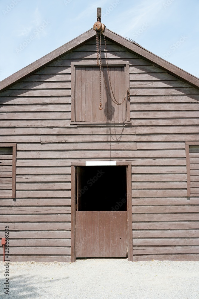 Old Rustic Wooden Board Barn in Countryside Setting Old Rustic Wooden Board Barn in Countryside Setting