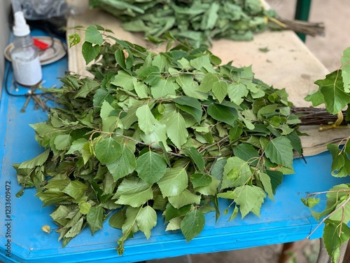 Green Bath broom made of birch branches. Drying birch bath brooms, massage with a broom.