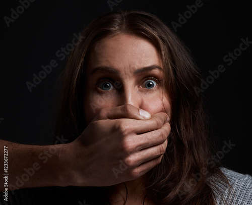 Photography Studio, woman and scared with hand for abuse, domestic violence and anxious in portrait for abduction